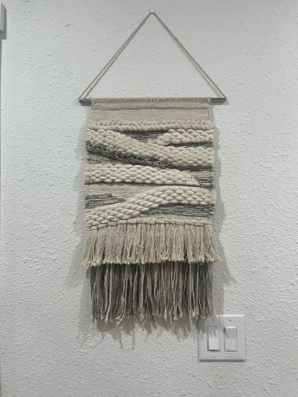 Gray and cream macramé wall hanging